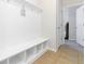 Functional mudroom with built-in bench, storage cubbies, and tiled floor, providing convenient organization at 441 Spring View Dr, Woodstock, GA 30188