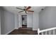 Bedroom featuring hardwood floors, a ceiling fan, and entry to ensuite bathroom at 70 Ruzelle Se Dr, Atlanta, GA 30354