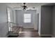 Bright bedroom with stairs to another level, neutral walls, and wood-look flooring at 70 Ruzelle Se Dr, Atlanta, GA 30354