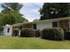 Ranch-style home with a brick exterior, lush landscaping, and a well-maintained lawn at 70 Ruzelle Se Dr, Atlanta, GA 30354