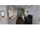 Kitchen with laminate countertops, appliances, tile backsplash, and hardwood floors at 70 Ruzelle Se Dr, Atlanta, GA 30354