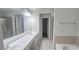 Bathroom with double sink vanity, large mirror and separate shower and tub at 2061 Fosco Dr, Duluth, GA 30097
