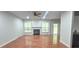 Spacious living room features hardwood floors, recessed lights, a fireplace, and a ceiling fan at 2061 Fosco Dr, Duluth, GA 30097