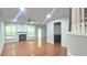 Bright living room with hardwood floors, a cozy fireplace, and a ceiling fan for added comfort and style at 2061 Fosco Dr, Duluth, GA 30097