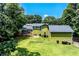 Aerial view of a home featuring a backyard, deck, and lush greenery, showcasing the property's outdoor space at 3778 Berdon Ln, Decatur, GA 30034