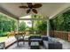 Covered back patio with stylish seating, a ceiling fan, and lush greenery creating a perfect outdoor retreat at 3778 Berdon Ln, Decatur, GA 30034