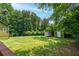 Expansive backyard with lush green grass and two storage sheds, perfect for outdoor activities and storage solutions at 3778 Berdon Ln, Decatur, GA 30034