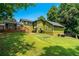 Expansive backyard features lush lawn, mature trees, and a spacious deck perfect for outdoor entertaining at 3778 Berdon Ln, Decatur, GA 30034