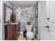 Bathroom featuring a dark wood vanity, tile accents, and a marble accent wall at 3778 Berdon Ln, Decatur, GA 30034