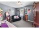 Neutral bedroom features a plush loveseat, dresser, and carpeted floors at 3778 Berdon Ln, Decatur, GA 30034