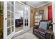 Small sitting room with furniture, including a bedroom view through french doors at 3778 Berdon Ln, Decatur, GA 30034