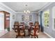 Elegant dining room with stylish decor, chandelier, and ample natural light at 3778 Berdon Ln, Decatur, GA 30034