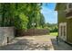 Outdoor recreation space with sport court, bordered by wooden fence and lush greenery at 3778 Berdon Ln, Decatur, GA 30034