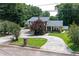 Charming home with a well-manicured lawn, circular driveway, and inviting front porch at 3778 Berdon Ln, Decatur, GA 30034