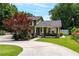 Charming home featuring a covered porch, lush landscaping, and a spacious driveway at 3778 Berdon Ln, Decatur, GA 30034