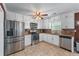 Well-equipped kitchen with stainless steel appliances, ample counter space, and tile backsplash at 3778 Berdon Ln, Decatur, GA 30034