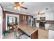 Bright kitchen features granite counters, tile backsplash, stainless steel appliances, and an island with seating at 3778 Berdon Ln, Decatur, GA 30034