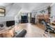 Cozy living room with brick fireplace, gray walls, tile floors, and stairs leading up at 3778 Berdon Ln, Decatur, GA 30034