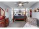 Main bedroom features a four poster bed, carpeted floors, and neutral paint at 3778 Berdon Ln, Decatur, GA 30034