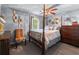 Main bedroom features a four-poster bed, plush carpet, and neutral walls with decor at 3778 Berdon Ln, Decatur, GA 30034