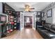 Finished basement space with wood flooring, a sofa, and sports memorabilia displayed at 3778 Berdon Ln, Decatur, GA 30034