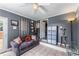 Sun room with gray walls, tile floors, ceiling fan, and a comfortable sofa at 3778 Berdon Ln, Decatur, GA 30034