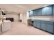 Finished basement with built-in cabinets, desk area, and additional space for recreation at 3812 Chattawood Dr, Duluth, GA 30096