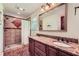 Bathroom features a double sink vanity with granite countertops and a tiled walk-in shower at 3812 Chattawood Dr, Duluth, GA 30096