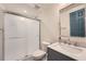 Bathroom featuring a modern vanity, sleek mirror, and glass-enclosed shower at 3812 Chattawood Dr, Duluth, GA 30096