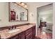 Bathroom features a double sink vanity with granite countertops and stylish fixtures at 3812 Chattawood Dr, Duluth, GA 30096