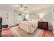 Light-filled bedroom with neutral walls, hardwood floors, and stylish decor at 3812 Chattawood Dr, Duluth, GA 30096