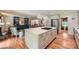 Spacious kitchen featuring a large center island, stainless steel appliances, and hardwood floors at 3812 Chattawood Dr, Duluth, GA 30096