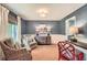 A living room with textured wallpaper, hardwood floors, and stylish furnishings and trim at 3812 Chattawood Dr, Duluth, GA 30096