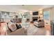 Open-concept living room connects to the kitchen, featuring a stone fireplace and hardwood floors at 3812 Chattawood Dr, Duluth, GA 30096