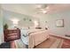 Comfortable main bedroom featuring hardwood floors and soothing paint with ample natural light at 3812 Chattawood Dr, Duluth, GA 30096