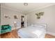Bedroom with hardwood floors, green chair, and plant decor at 975 Dill Sw Ave, Atlanta, GA 30310