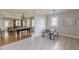 A dining area features a table with bench seating, connecting to a living area with a pool table at 975 Dill Sw Ave, Atlanta, GA 30310