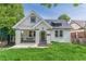 Charming one-and-a-half-story home with white painted brick, black trim and a covered porch with a swing at 975 Dill Sw Ave, Atlanta, GA 30310