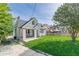 Charming one-and-a-half-story home with white painted brick, black trim and a covered porch with a swing at 975 Dill Sw Ave, Atlanta, GA 30310