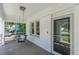Inviting front porch with a swing, white columns, and a decorative front door at 975 Dill Sw Ave, Atlanta, GA 30310