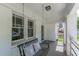 Comfortable front porch featuring a classic swing, perfect for relaxing and enjoying the outdoors at 975 Dill Sw Ave, Atlanta, GA 30310