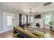 Charming living room featuring a decorative fireplace, hardwood floors, and stylish furnishings with neutral tones at 975 Dill Sw Ave, Atlanta, GA 30310