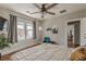 A main bedroom with hardwood floors, neutral walls, a ceiling fan, and natural light at 975 Dill Sw Ave, Atlanta, GA 30310