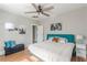 A main bedroom with decor, hardwood floors, a ceiling fan, and a bench at 975 Dill Sw Ave, Atlanta, GA 30310