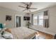 A spacious main bedroom with a ceiling fan, large windows, and hardwood floors at 975 Dill Sw Ave, Atlanta, GA 30310