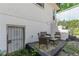Cozy patio with seating and a door to the lower level, blending indoor comfort with outdoor charm at 975 Dill Sw Ave, Atlanta, GA 30310