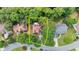 An aerial view showcases the home's position on a tree-lined street with a private backyard at 1441 Hada Ln, Lawrenceville, GA 30043