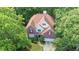 Aerial view of the home, nestled in a canopy of trees, highlighting its inviting curb appeal at 1441 Hada Ln, Lawrenceville, GA 30043