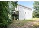 Exterior backyard featuring a house with a deck and lush green foliage at 1441 Hada Ln, Lawrenceville, GA 30043