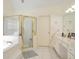 Spacious primary bathroom featuring a separate shower, bathtub, and dual sink vanity at 1441 Hada Ln, Lawrenceville, GA 30043